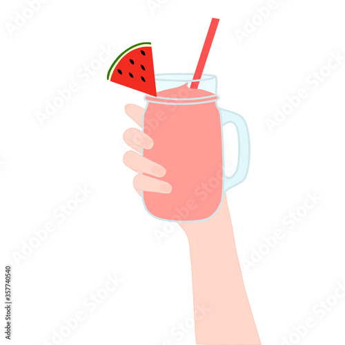 Hand is holding​ a smoothie juice in a glass cup with and has watermelon slice on top. The cold beverage for the summer season. Healthy and organic drink.
