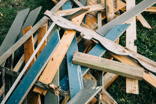a large pile of scrap wood from a demolished building during the demolition process