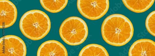 Slice of fresh orange isolated on blue background