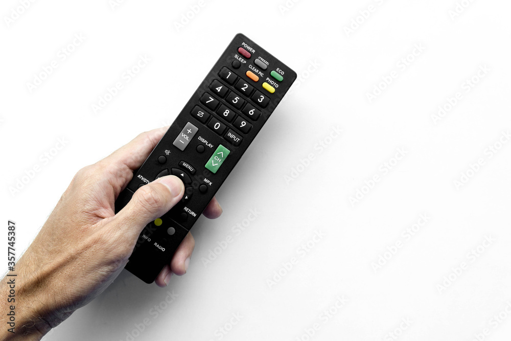 Man holding remote control on white background Man holding remote control on white background