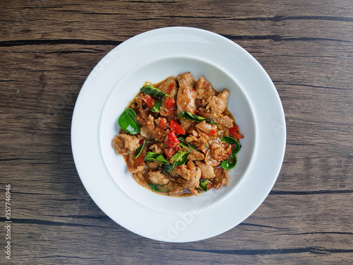 Spicy Pork with shrimp-paste sauce in white plate onthe table, Top view