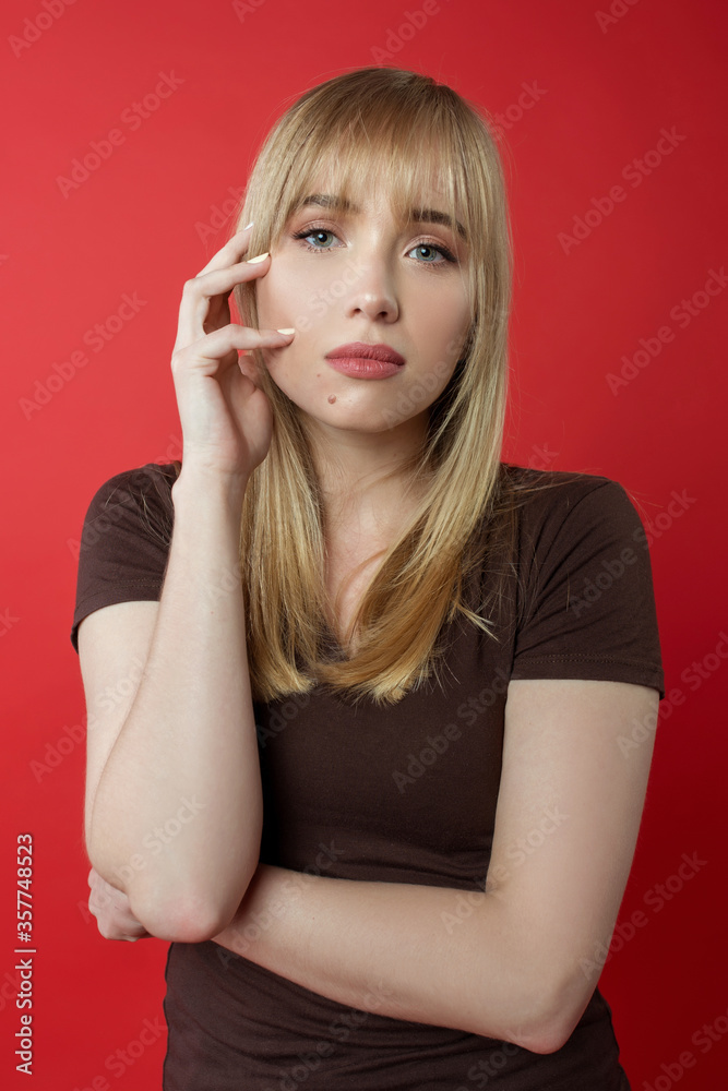 Blonde cheerful woman in brown t-shirt showing correct (right) modeling, posing. Beauty, fashion, youth concept
Blonde cheerful woman in brown t-shirt showing correct (right) modeling, posing. Beauty, fashion, youth concept