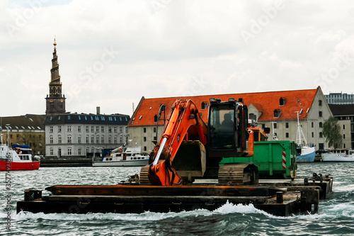 Photography Tug boat with excavator