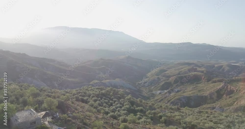 Sierra Nevada (Spain) mountain range & orchards with drone shot in 4k