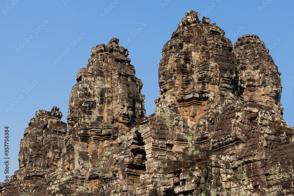 Close up of famous faces at the facade of Bayon temple, center of Angkor Thom complex in Siem Reap, Cambodia, South east Asia