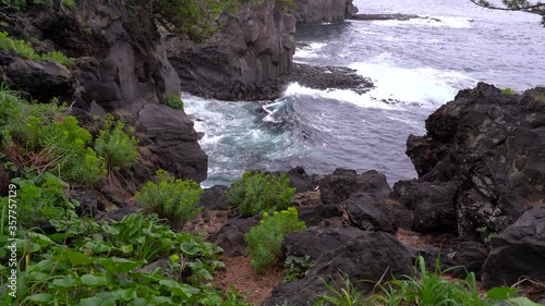 Beautiful Scenery On Rocky Cliffs With Breaking Waves on the Jogasaki Coast in Japan. - static shot photo