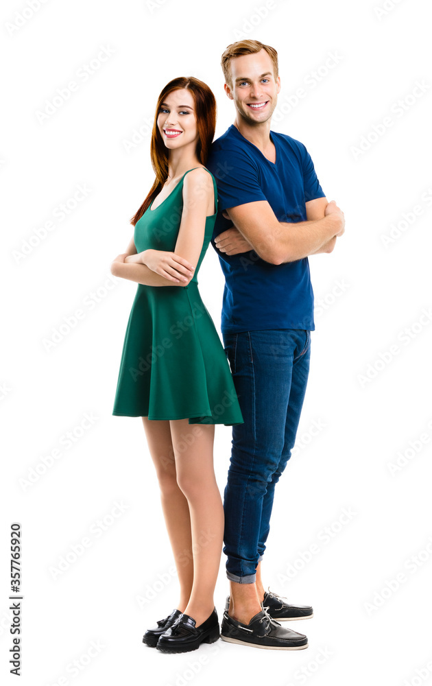 Smiling attractive amorous couple. Full body length portrait image of standing back to back models at happy in love studio concept, isolated over white background. Man and woman posing together. Smiling attractive amorous couple. Full body length portrait image of standing back to back models at happy in love studio concept, isolated over white background. Man and woman posing together.