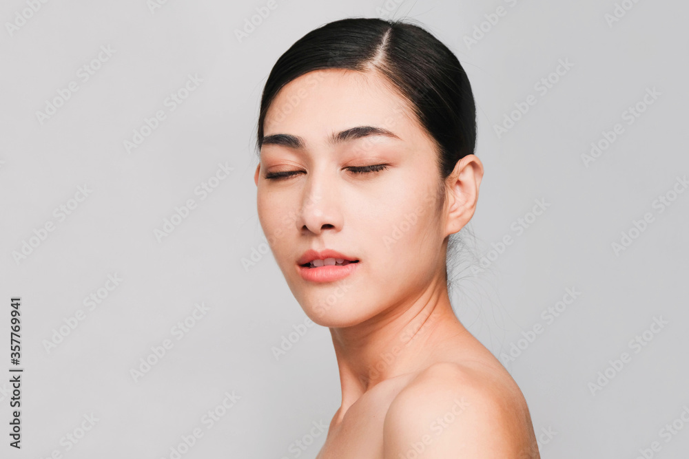 Face of Young beautiful asian woman with clean, fresh and bright skin, Happiness and cheerful with positive emotional,isolated on gray background,Beauty Cosmetics and Facial treatment Concept Face of Young beautiful asian woman with clean, fresh and bright skin, Happiness and cheerful with positive emotional,isolated on gray background,Beauty Cosmetics and Facial treatment Concept