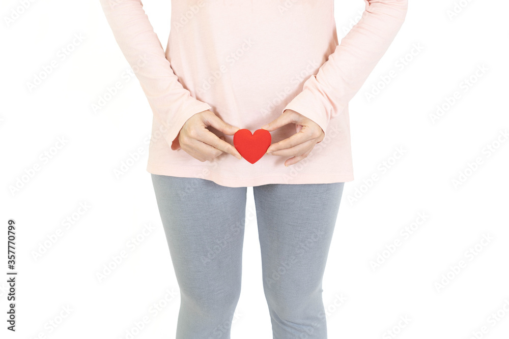 woman holding red heart put on the genitalia area, Penis pain or Itching urinary Health-care concept on white background - obrazy, fototapety, plakaty 