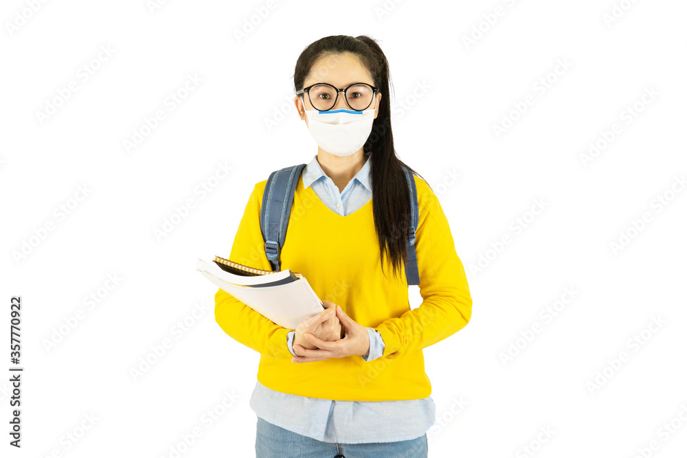 Young asian student woman in glasses wearing medical face mask,carrying a bag to go to school Under the outbreak of the virus isolated on white background Young asian student woman in glasses wearing medical face mask,carrying a bag to go to school Under the outbreak of the virus isolated on white background