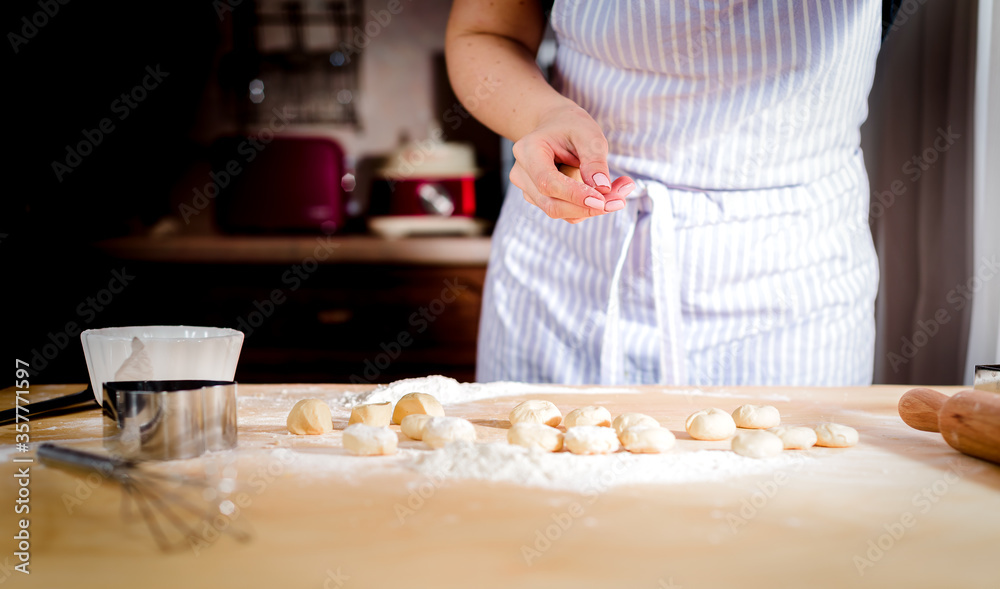 chef kneads baking dough, dirty chef hands in pastry, cooking, bakery concept