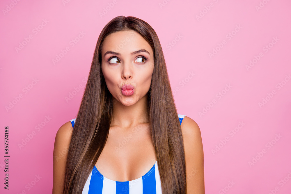 Closeup photo of adorable lady perfect straight hairstyle smooth bronze body skin send air kisses shy look side wear white blue striped bodysuit isolated pastel pink color background Closeup photo of adorable lady perfect straight hairstyle smooth bronze body skin send air kisses shy look side wear white blue striped bodysuit isolated pastel pink color background