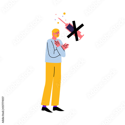 Displeased man standing and refusing to get vaccination from disease