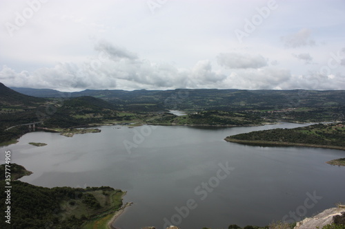 Temo lake in Sardinia, Monteleone Rocca Doria, aerial view, cloudy sky