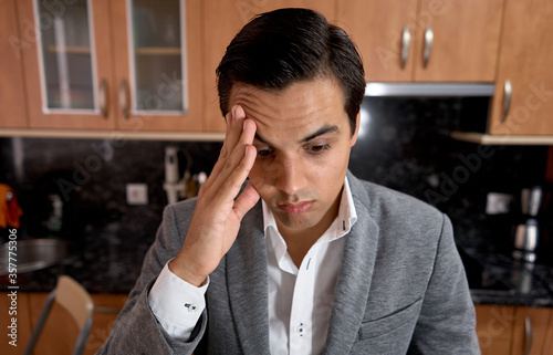 guy with eyes tired from seeing the laptop