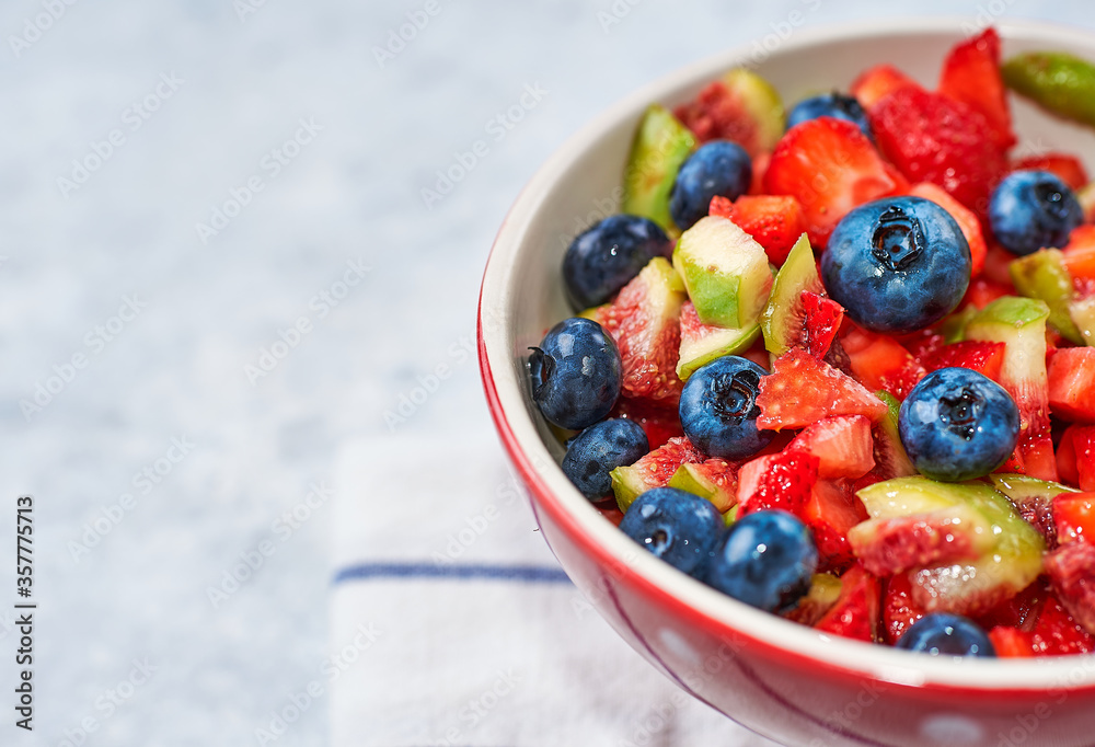 fig strawberry blueberry fruit salad, concept diet and healthy eating fig strawberry blueberry fruit salad, concept diet and healthy eating