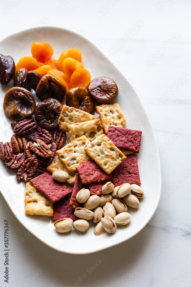 Dried fruit nuts and snack variety forming a background. Health food high in antioxidants, protein, omega 3. minerals, vitamins and anthocyanins.