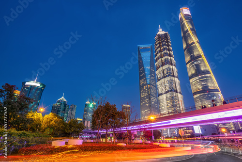 Oriental Pearl TV Tower and commercial buildings located in the Lujiazui financial district at night, Shanghai,China