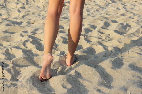 woman legs on the beach
