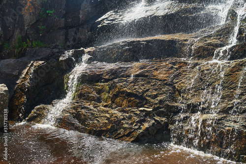 Waterfall Gadelsha at springtime, South Urals, Russia. photo