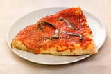 Single slice of Marinara pizza with anchovy