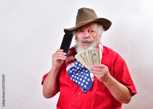 Texas rancher is showing off the money he won playing the lottery. .Gentleman wearing a patriotic bandana, western hat is on the  phone bragging aboujt the money he won.