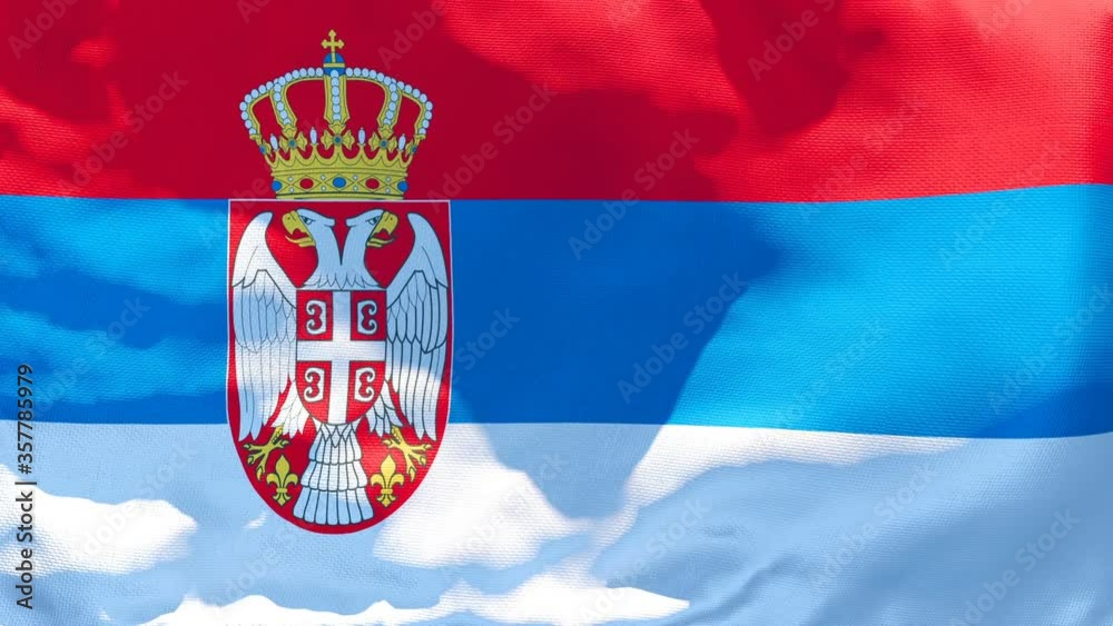 The national flag of Serbia flutters in the wind The national flag of Serbia flutters in the wind