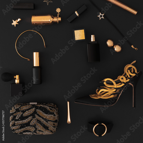 Luxury set of cosmetics and accessories in black and gold on a black background, layout, for design