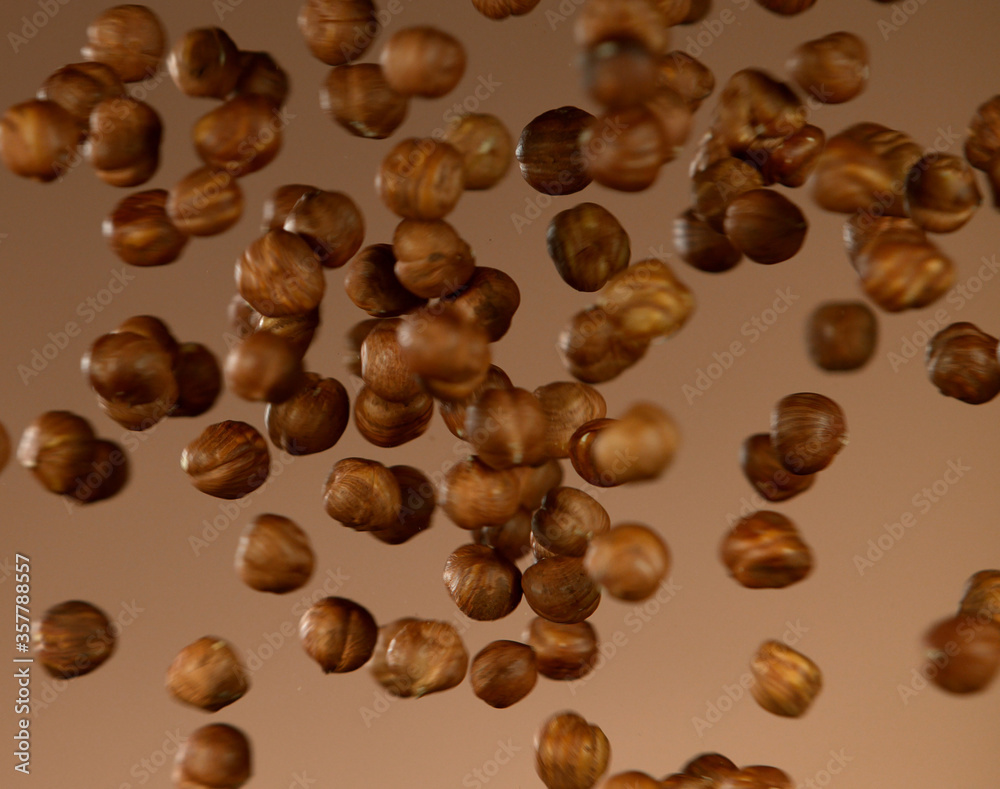 Naklejka premium Realistic freeze motion of flying almonds