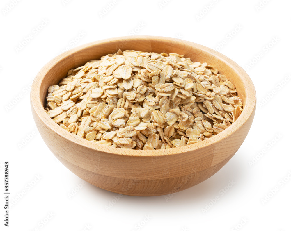 Oatmeal in a wooden bowl set against a white background.