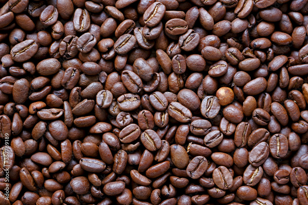 Naklejka premium roasted coffee beans background