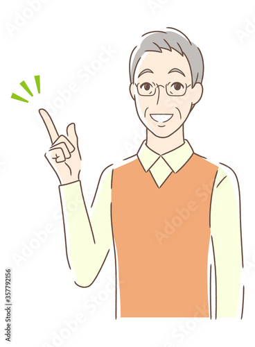 笑顔で指をさす男性