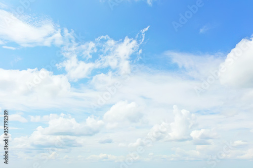 white clouds on blue sky background  abstract seasonal wallpaper  sunny day atmosphere