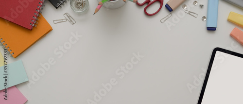 Copy space on white office desk with digital device, stationery and office supplies