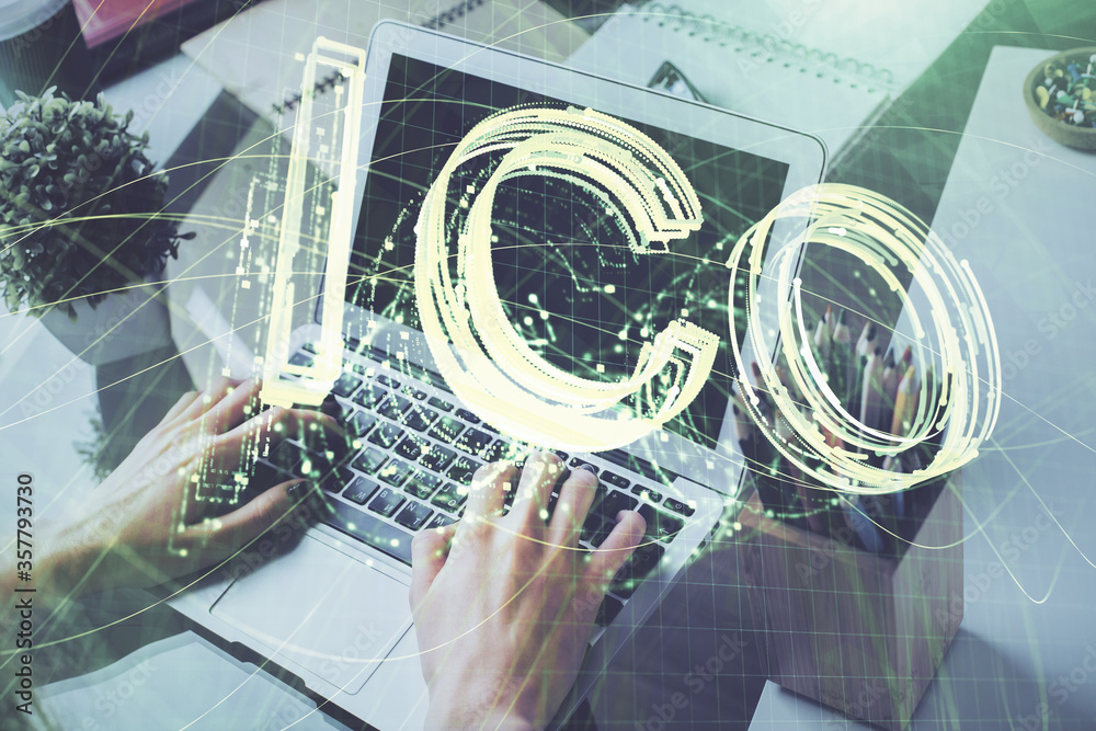 Crypto currency theme hologram with businessman working on computer on background. Concept of blockchain. Double exposure. Crypto currency theme hologram with businessman working on computer on background. Concept of blockchain. Double exposure.