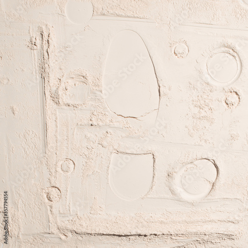 Background with the texture of fine white sand or powder with a boot imprint and craters, for design, mock-up