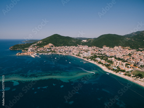 The coast and beach line of the city of Budva in Montenegro. The city on the adriatic coast. Long coastline.