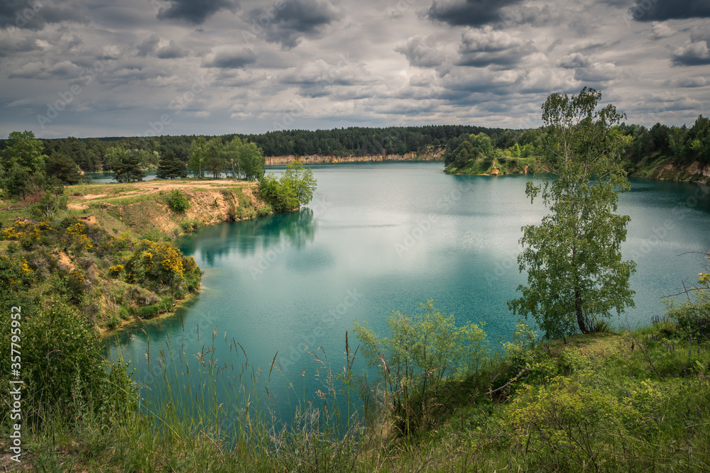 Turquoise lake Wapienniki near Sulejow, Lodzkie, Poland