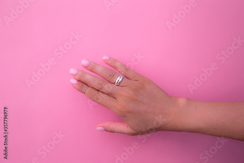 Woman hand with fashion manicure showing her rings