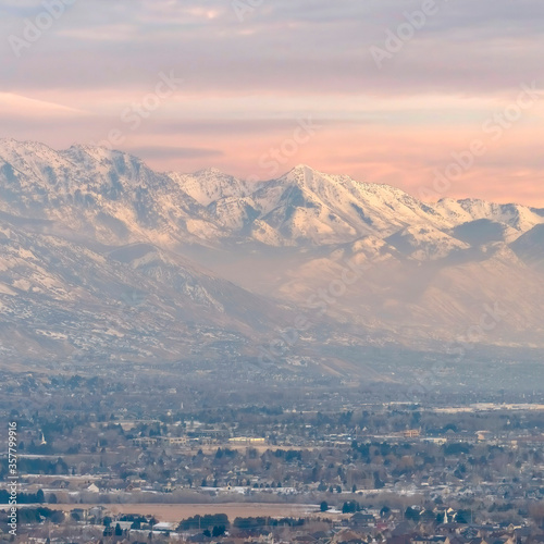 Square Stunning Wasatch Mountains and Utah Valley with houses dusted with winter snow