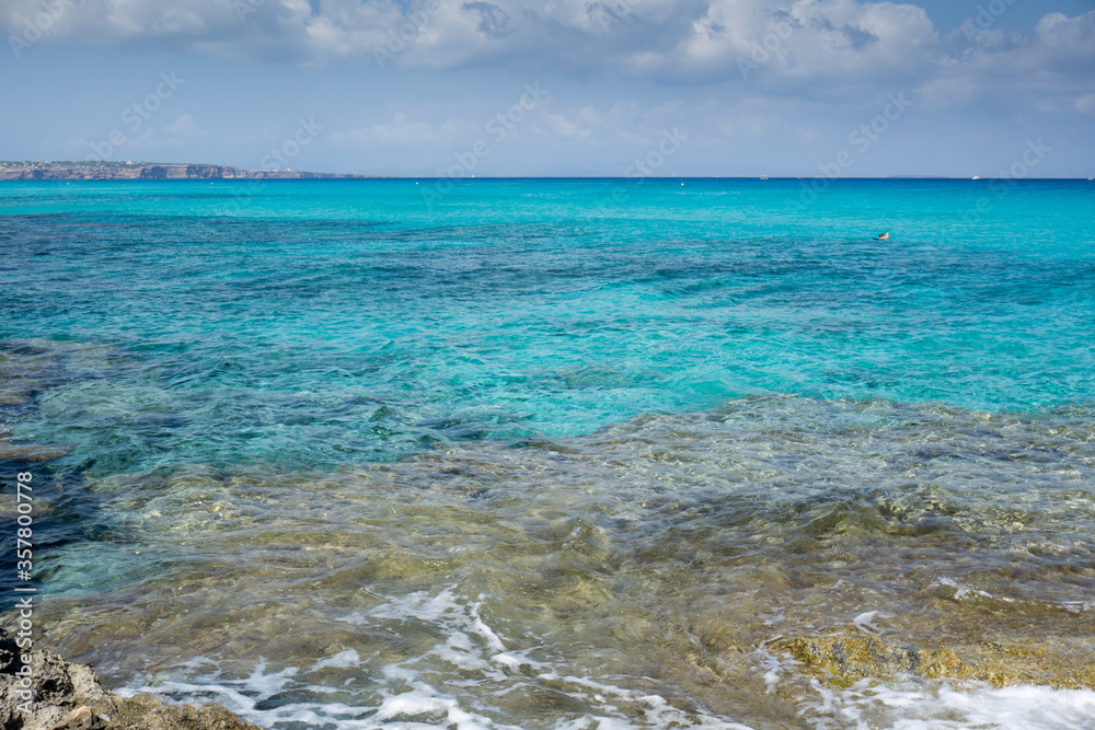 Turquoise water in Formentera Es Calo de San Agusti beach Balearic islands Spain on September 5, 2018