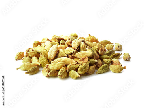 Photography Small pile of green cardamon seeds isolated on the white background