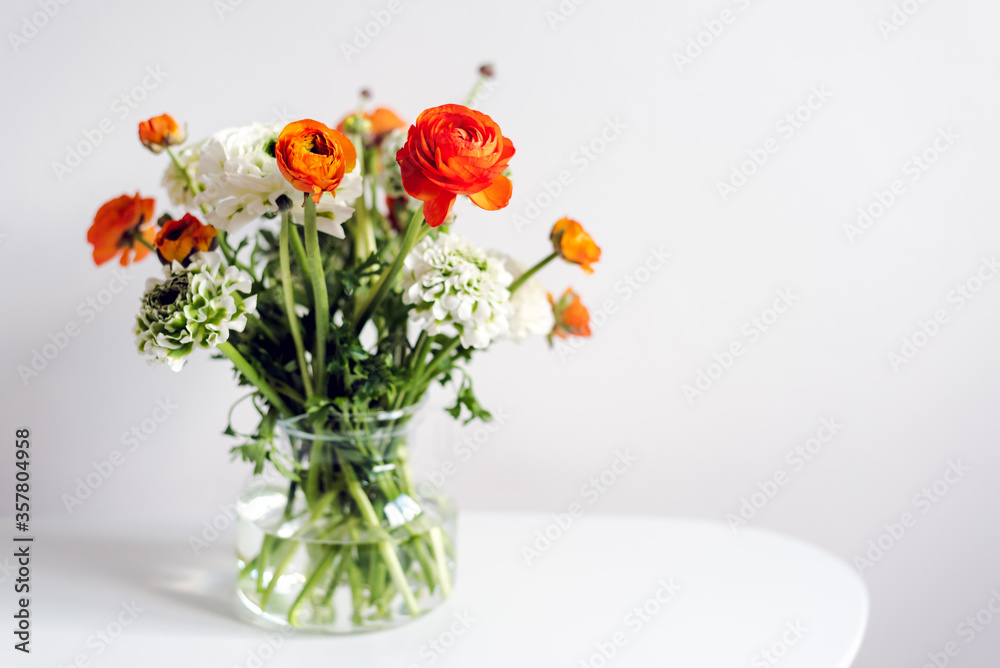 A bouquet of fresh ranunculus on the table.