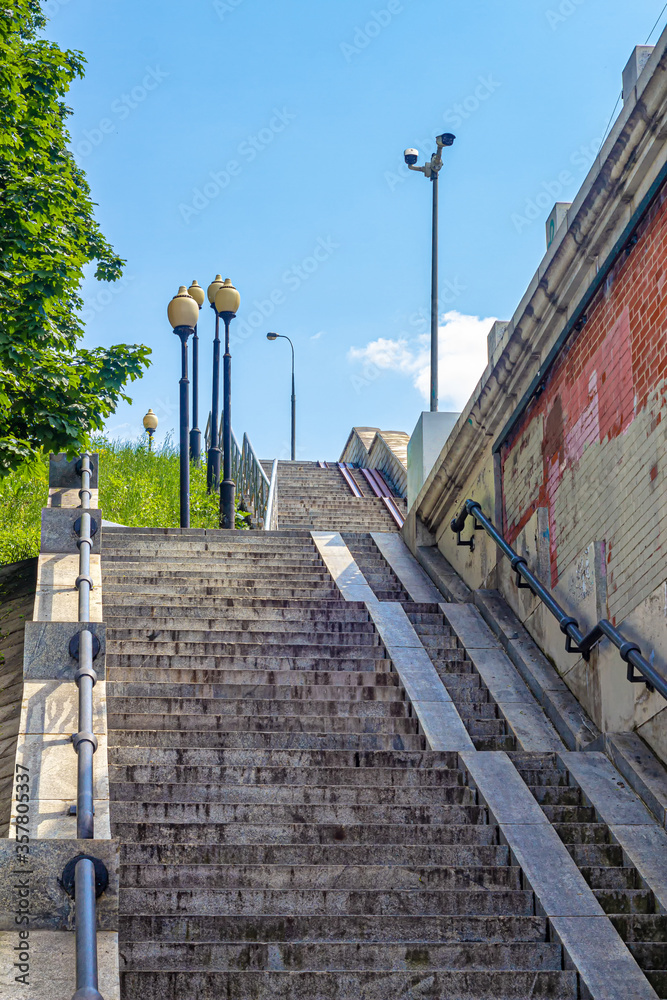Flights of stairs leading to the bridge, with railings and stone steps