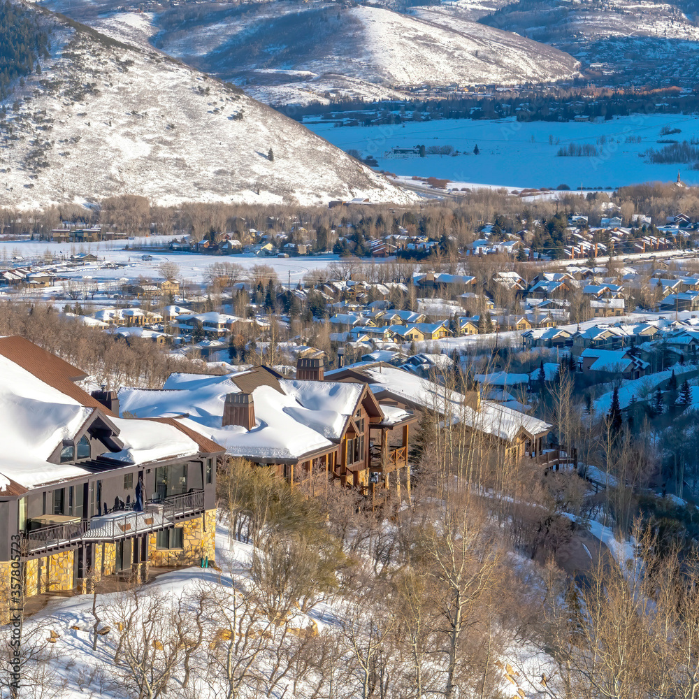 Square crop Picturesque Park City Utah winter landscape with snowy homes and frosted hills