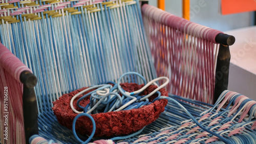 Knitting chair from fabric, Cotton or silk and colorful thread in basket