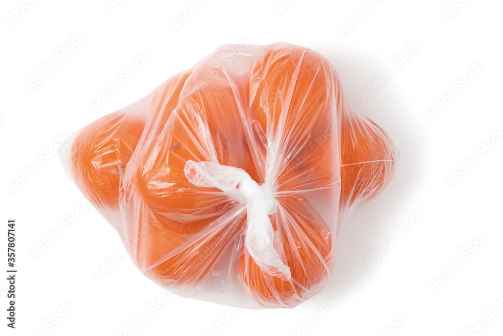Several tangerines in a package isolated on a white background with clipping paths with and without shadow, top view Several tangerines in a package isolated on a white background with clipping paths with and without shadow, top view