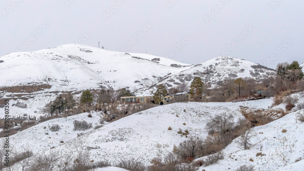 Panorama Mountain homes in Salt Lake City landscape blanketed with snow in winter