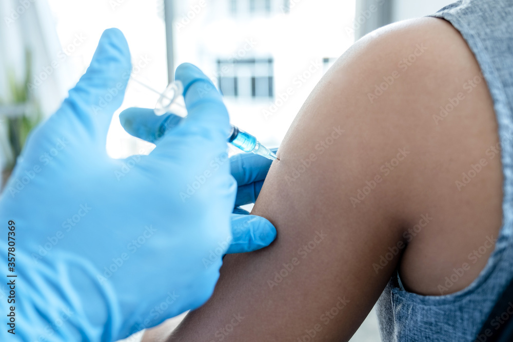 Fototapeta premium doctors vaccinated with syringes to prevent epidemics at hospitals, health care and medical concepts