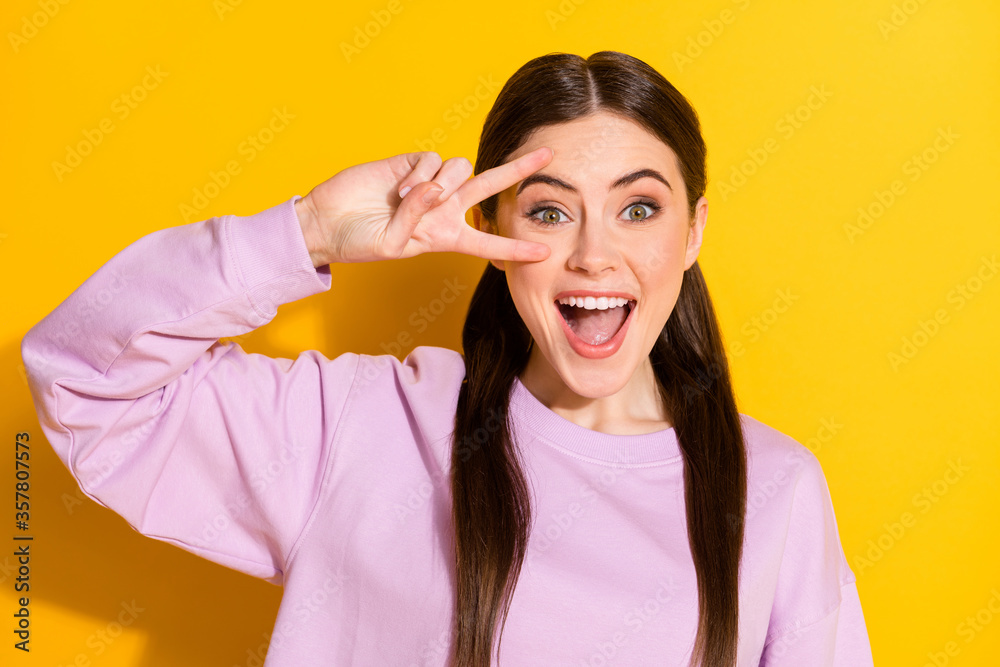 Portrait of candid crazy girl enjoy spring weekend free time feel rejoice make v-sign wear good look jumper isolated over bright color background Portrait of candid crazy girl enjoy spring weekend free time feel rejoice make v-sign wear good look jumper isolated over bright color background